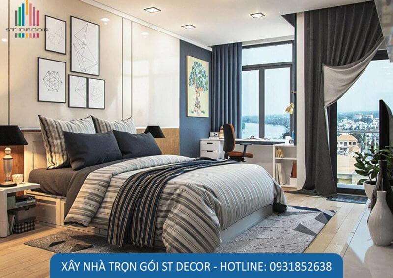 Phòng ngủ có tông màu trầm, sàn được làm bằng gỗ, kệ để sách rộng rãi giúp việc thư giãn, học tập tốt hơn
